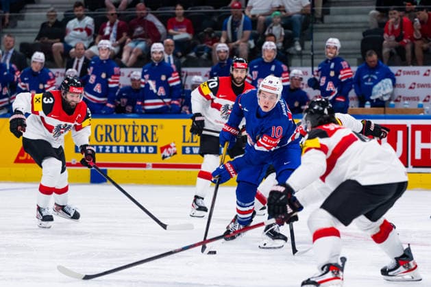 ZURICH, SWITZERLAND - MAY 26: James Hagens (United States, 10) in the battle for the puck with Ramon Schnetzer (Austria, 4) during the Preliminary Round - Group A Match 53 between United States and Austria at the IIHF Ice hockey, Eishockey World Championship, WM, Weltmeisterschaft 2026, Swiss Life Arena on May 26, 2026 in Zurich, Switzerland. Zurich Switzerland Copyright: xTimoxSteinx
