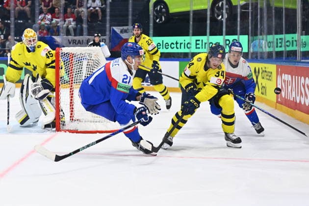 From left Sebastian Cederle of Slovakia and Albert Johansson of Sweden in action during the IIHF World Championship, WM, Weltmeisterschaft Group B match Sweden vs Slovakia on May 26, 2026, Fribourg, Switzerland. (CTKxPhoto RadekxPetrasek) CTKPhotoP2026052607632  CTKPhotoP2026052607632