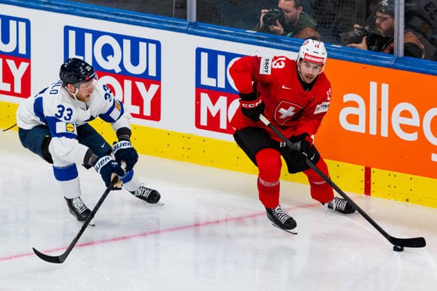 ZURICH, SWITZERLAND - MAY 26: Nico Hischier (Switzerland, 13) in the battle for the puck with Nikolas Matinpalo (Finland, 33) during the Preliminary Round - Group A Match 55 between Switzerland and Finland at the IIHF Ice hockey, Eishockey World Championship, WM, Weltmeisterschaft 2026, Swiss Life Arena on May 26, 2026 in Zurich, Switzerland. Zurich Switzerland Copyright: xTimoxSteinx