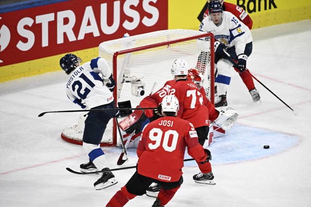 LKS 20260526 Patrik Puistola (L) of Finland fails to score against goalkeeper Reto Berra of Switzerland during the 2026 IIHF Ice hockey, Eishockey World Championships preliminary round group A match between Switzerland and Finland in Zurich on May 26, 2026. - RONI REKOMAA Zürich Switzerland sgKpdiX_qxI  Copyright: xRonixRekomaax sgKpdiX_qxI