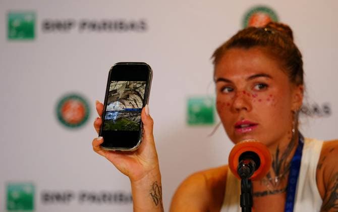 Following her first round win over Russian opponent Elena Pridankina, an emotional Oleksandra Oliynykova shows the gathered press a photograph of bombed out tennis courts in Ukraine, courts on which she used to play as a child French Open Tennis, Day Three, Tennis, Roland Garros, Paris, France - 26 May 2026Paris Roland Garros France EDITORIAL USE ONLY No use with unauthorised audio, video, data, fixture lists, club league logos or live services. Online in-match use limited to 120 images, no video emulation. No use in betting, games or single club league player publications. Copyright: xJavierxGarcia Shutterstockx 16898258ea