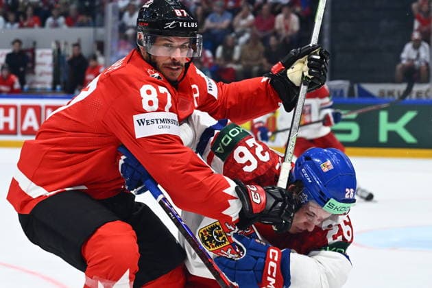 Sidney Crosby of Canada, left, and Jiri Tichacek of Czech Republic in action during the IIHF World Championship, WM, Weltmeisterschaft Group B match Czech Republic vs Canada on May 26, 2026, Fribourg, Switzerland. (CTKxPhoto RadekxPetrasek) CTKPhotoP2026052609117  CTKPhotoP2026052609117
