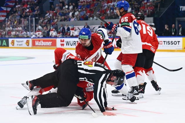 David Tomasek of Czech Republic, center, and referee in action during the IIHF World Championship, WM, Weltmeisterschaft Group B match Czech Republic vs Canada on May 26, 2026, Fribourg, Switzerland. (CTKxPhoto RadekxPetrasek) CTKPhotoP2026052609181  CTKPhotoP2026052609181