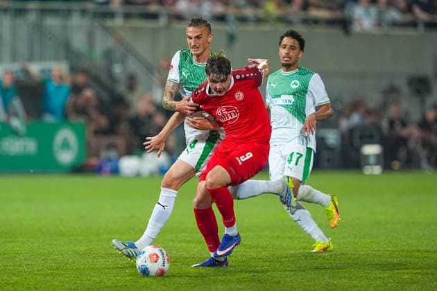 26 05 2026, xydrx, Men, Soccer, Relegation second leg, 2 Bundesliga, SpVgg Greuther Fürth Rot Weiss Essen, Season 2025 2026, Sportpark Ronhof Philipp Ziereis SpVgg Greuther Fürth, 4 and Sayfallah Ltaief SpVgg Greuther Fürth, 47 in duel against Jaka Cuber Potocnik Rot Weiss Essen, 9 DFB regulations prohibit any use of photographs as image sequences and or quasi video Copyright: HMBxMedia YannisxDreimann