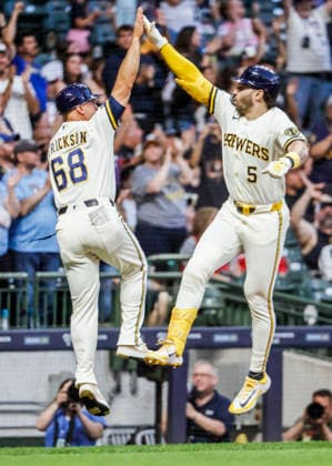 Milwaukee Brewers center fielder Garrett Mitchell (R) celebrates with Milwaukee Brewers third base coach Matt Erickson (L) after hitting a three RBI home run in the fifth inning of the MLB, Baseball Herren, USA game between the St. Louis Cardinals and the Milwaukee Brewers at American Family Field in Milwaukee, Wisconsin on Tuesday, May 26, 2026.  MIL20260526822 TANNENxMAURY