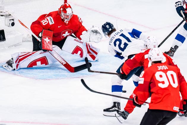 xxkeikkaxx 20260526 Swiss Life Arena, Zurich, Switzerland. IIHF Ice hockey, Eishockey World Championships match Switzerland vs Finland Patrik Puistola (21) of Team Finland Reto Berra (20) of Team Switzerland Dominik Egli (72) of Team Switzerland Roman Josi (90) of Team Switzerland Photo by Pasi Suokko All Over Press  1.06232469