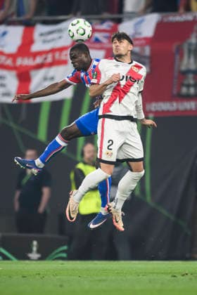 Crystal Palace FC v Rayo Vallecano de Madrid - UEFA Conference League Tyrick Mitchell of Crystal Palace FC competes for a header with Andrei Ratiu of Rayo Vallecano de Madrid during the UEFA Conference League 2025 26 final football match between Crystal Palace FC and Rayo Vallecano de Madrid. Leipzig Germany Copyright: xNicolòxCampox