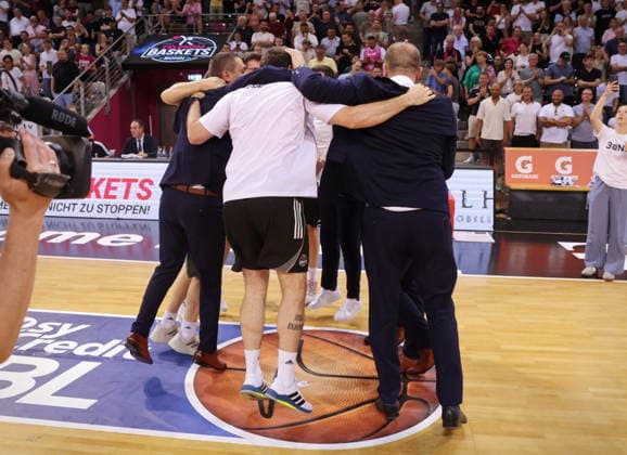 Coach Marko Stankovic and Team Telekom Baskets Bonn cheer after victory against Fitness First Würzburg Wuerzburg Baskets Playoffs Quarterfinals Game 5 Season 2025 26