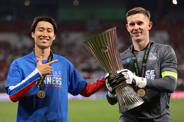 Leipzig, Germany, 27th May 2026. Daichi Kamada and Dean Henderson of Crystal Palace FC pose with the trophy following the 1-0 victory in the Crystal Palace vs Rayo Vallecano UEFA Conference League Final match at Leipzig Stadium, Leipzig. Picture credit should read: Jonathan Moscrop Sportimage EDITORIAL USE ONLY. No use with unauthorised audio, video, data, fixture lists, club league logos or live services. Online in-match use limited to 120 images, no video emulation. No use in betting, games or single club league player publications. SPI_024_JM_CPALACE_RVALLECANO_UECL SPI-4824-0023
