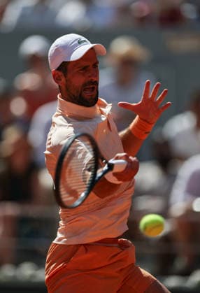 (260527) -- PARIS, May 27, 2026 -- Novak Djokovic hits a return during the men s singles second round match between Novak Djokovic of Serbia and Valentin Royer of France at the French Open tennis tournament at Roland Garros, Paris, France, May 27, 2026. ) (SP)FRANCE-PARIS-TENNIS-FRENCH OPEN-MEN S SINGLES-2ND ROUND-NOVAK DJOKOVIC VS VALENTIN ROYER WuxHuiwo 