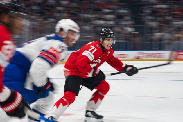 FRIBOURG, FRIBOURG - MAY 28: Macklin Celebrini of Canada attempts to break away during the 2026 IIHF World Championship, WM, Weltmeisterschaft quarterfinal match between Canada and the United States at BCF Arena on May 28, 2026 in Fribourg, Fribourg, Switzerland.  Copyright: xLivioxBaeriswylx xSPPx Sportspressphoto_SPR156148