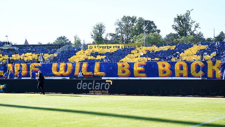 Soccer Regionalliga season 2025 2026, promotion matches to the 3 Liga, first leg, 1 FC Lokomotive Leipzig vs Würzburger Kickers 28 05 2026 Choreo of the Lok fans We will be back at the match Lok Leipzig vs Würzburg 28 05 2026 Leipzig Saxony Germany Bruno Plache Stadium