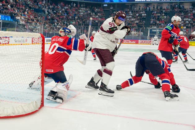 FRIBOURG, SWITZERLAND MAY 28 goalkeeper Henrik Haukeland of Norway L saves despite a screen of Oskars Batna of Latvia C during the 2026 IIHF Ice Hockey World Championship Switzerland game between Norway and Latvia at BCF Arena on May 28, 2026 in Fribourg, Fribourg Fribourg BCF Arena Fribourg Switzerland Copyright: xJustPictures.ch JarixPestelaccix jp-en-EuSpIm-JP6_JAR_Norway_Latvia_28May2026_00027