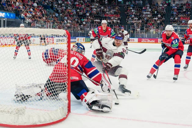 FRIBOURG, SWITZERLAND MAY 28 Eduards Tralmaks of Latvia 2nd L against goalkeeper Henrik Haukeland of Norway during the 2026 IIHF Ice Hockey World Championship Switzerland game between Norway and Latvia at BCF Arena on May 28, 2026 in Fribourg, Fribourg Fribourg BCF Arena Fribourg Switzerland Copyright: xJustPictures.ch JarixPestelaccix jp-en-EuSpIm-JP6_JAR_Norway_Latvia_28May2026_00130