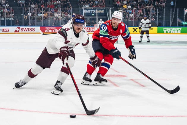 FRIBOURG, FRIBOURG - MAY 28: Renars Krastenbergs of Latvia battles with Christian Kaasastul of Norway during the 2026 IIHF World Championship, WM, Weltmeisterschaft match between Norway and Latvia at BCF Arena on May 28, 2026 in Fribourg, Fribourg, Switzerland.  Copyright: xLivioxBaeriswylx xSPPx Sportspressphoto_SPR156470