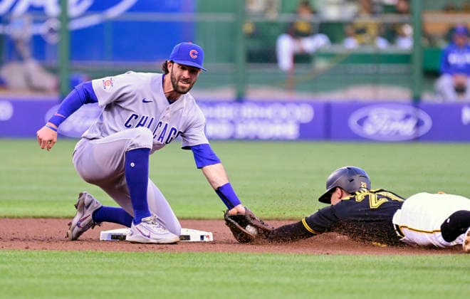 Pittsburgh Pirates left fielder Jake Mangum (28) is out at second base attempting to steal as Chicago Cubs shortstop Dansby Swanson (7) makes the tag in the fourth inning at PNC Park on Thursday, May 28, 2026 in Pittsburgh.  PIT2026052817 ArchiexCarpenter