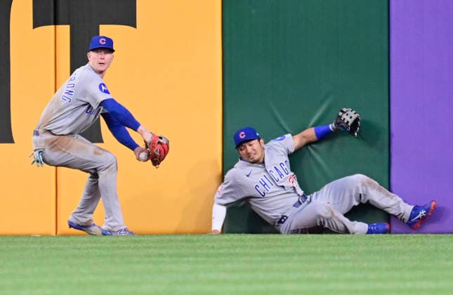 Pittsburgh Pirates Tyler Calihan doubles as Chicago Cubs right fielder Seiya Suzuki (27) misses the catch at the wall and Chicago Cubs center fielder Pete Crow-Armstrong (4) throws to the infield during the sixth inning of the Cubs 7-2 win at PNC Park on Thursday, May 28, 2026 in Pittsburgh.  PIT2026052822 ArchiexCarpenter