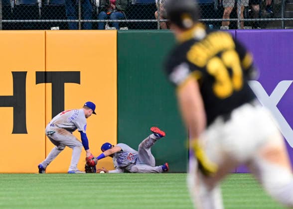 Pittsburgh Pirates Tyler Calihan (37) doubles as Chicago Cubs right fielder Seiya Suzuki (27) misses the catch at the wall during the sixth inning of the Cubs 7-2 win at PNC Park on Thursday, May 28, 2026 in Pittsburgh.  PIT2026052823 ArchiexCarpenter