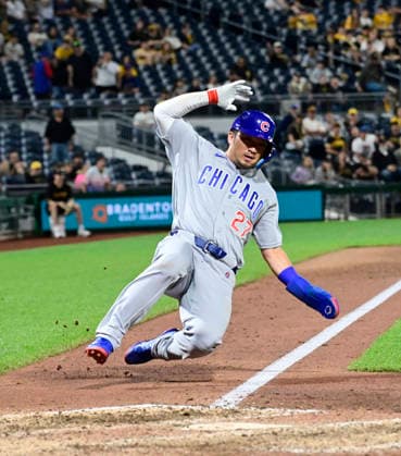 Chicago Cubs right fielder Seiya Suzuki (27) slides into home safe on a passed by by the Pittsburgh Pirates in the top of the eighth inning of the Cubs 7-2 win at PNC Park on Thursday, May 28, 2026 in Pittsburgh.  PIT2026052826 ArchiexCarpenter