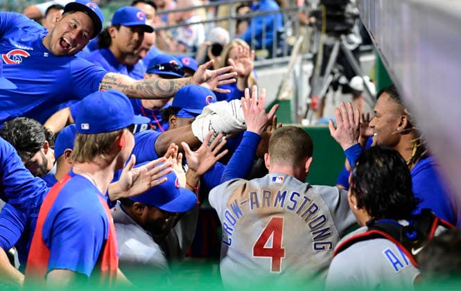 Chicago Cubs center fielder Pete Crow-Armstrong (4) celebrates in the dugout after the Chicago Cubs wins the challenge overturning the out call in the ninth inning of the Cubs 7-2 win at PNC Park on Thursday, May 28, 2026 in Pittsburgh.  PIT2026052832 ArchiexCarpenter