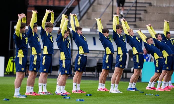 Scotland players stretch during warm up. Scotland Team Training, Football, Hampden Park, Glasgow, Scotland, UK - 29 May 2026Glasgow Hampden Park United Kingdom EDITORIAL USE ONLY No use with unauthorised audio, video, data, fixture lists, club league logos or live services. Online in-match use limited to 120 images, no video emulation. No use in betting, games or single club league player publications.  Copyright: xStuartxWallace Shutterstockx 16902976aq