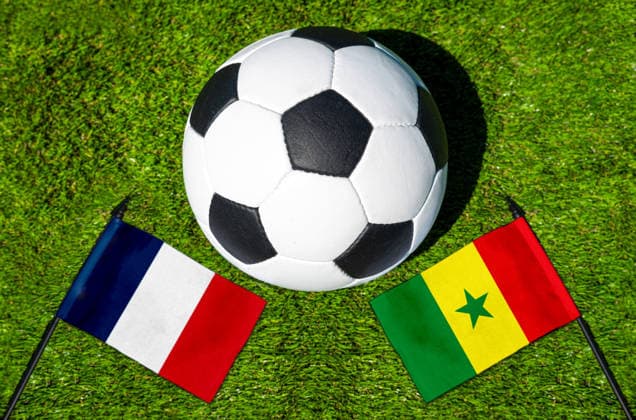 May 22, 2026: PHOTO MONTAGE, 2026 FIFA World Cup, WM, Weltmeisterschaft, Fussball National flags of France and Senegal with a soccer ball on the field. Stock image for the group stage match on June 16 at the 2026 FIFA World Cup *** FOTOMONTAGE, Fußball-Weltmeisterschaft 2026: Nationalflaggen von Frankreich und Senegal mit Fußball auf Rasen. Symbolbild zum WM-Gruppenspiel am 16 Juni bei der FIFA Fussball-Weltmeisterschaft 2026