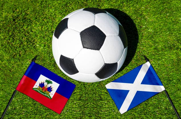 May 22, 2026: PHOTO MONTAGE, 2026 FIFA World Cup, WM, Weltmeisterschaft, Fussball National flags of Haiti and Scotland with a soccer ball on the field. Stock image for the group stage match on June 14 at the 2026 FIFA World Cup *** FOTOMONTAGE, Fußball-Weltmeisterschaft 2026: Nationalflaggen von Haiti und Schottland mit Fußball auf Rasen. Symbolbild zum WM-Gruppenspiel am 14 Juni bei der FIFA Fussball-Weltmeisterschaft 2026