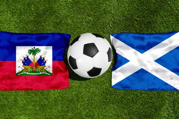 May 22, 2026: PHOTO MONTAGE, 2026 FIFA World Cup, WM, Weltmeisterschaft, Fussball National flags of Haiti and Scotland with a soccer ball on the field. Stock image for the group stage match on June 14 at the 2026 FIFA World Cup *** FOTOMONTAGE, Fußball-Weltmeisterschaft 2026: Nationalflaggen von Haiti und Schottland mit Fußball auf Rasen. Symbolbild zum WM-Gruppenspiel am 14 Juni bei der FIFA Fussball-Weltmeisterschaft 2026