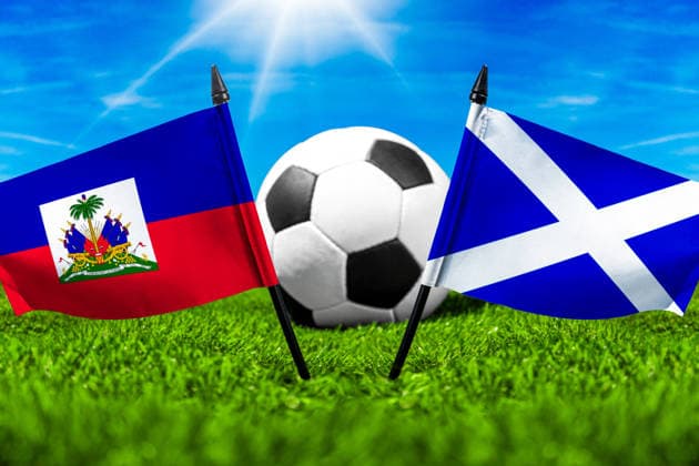 May 22, 2026: PHOTO MONTAGE, 2026 FIFA World Cup, WM, Weltmeisterschaft, Fussball National flags of Haiti and Scotland with a soccer ball on the field. Stock image for the group stage match on June 14 at the 2026 FIFA World Cup *** FOTOMONTAGE, Fußball-Weltmeisterschaft 2026: Nationalflaggen von Haiti und Schottland mit Fußball auf Rasen. Symbolbild zum WM-Gruppenspiel am 14 Juni bei der FIFA Fussball-Weltmeisterschaft 2026