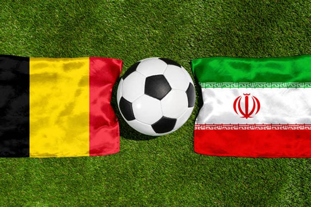 May 22, 2026: PHOTO MONTAGE, 2026 FIFA World Cup, WM, Weltmeisterschaft, Fussball National flags of Belgium and Iran with a soccer ball on the field. Illustrative image for the group stage match on June 21 at the 2026 FIFA World Cup *** FOTOMONTAGE, Fußball-Weltmeisterschaft 2026: Nationalflaggen von Belgien und Iran mit Fußball auf Rasen. Symbolbild zum WM-Gruppenspiel am 21 Juni bei der FIFA Fussball-Weltmeisterschaft 2026