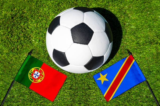 May 22, 2026: PHOTO MONTAGE, 2026 FIFA World Cup, WM, Weltmeisterschaft, Fussball National flags of Portugal and Congo with a soccer ball on the field. Stock image for the group stage match on June 17 at the 2026 FIFA World Cup *** FOTOMONTAGE, Fußball-Weltmeisterschaft 2026: Nationalflaggen von Portugal und Kongo mit Fußball auf Rasen. Symbolbild zum WM-Gruppenspiel am 17 Juni bei der FIFA Fussball-Weltmeisterschaft 2026