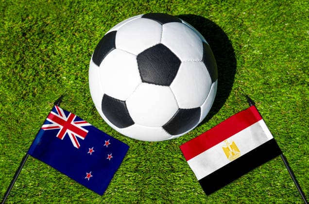 May 22, 2026: PHOTO MONTAGE, 2026 FIFA World Cup, WM, Weltmeisterschaft, Fussball National flags of New Zealand and Egypt with a soccer ball on a field. Stock image for the group stage match on June 22 at the 2026 FIFA World Cup *** FOTOMONTAGE, Fußball-Weltmeisterschaft 2026: Nationalflaggen von Neuseeland und Ägypten mit Fußball auf Rasen. Symbolbild zum WM-Gruppenspiel am 22 Juni bei der FIFA Fussball-Weltmeisterschaft 2026