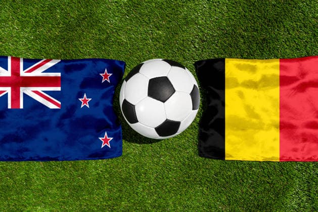 May 22, 2026: PHOTO MONTAGE, 2026 FIFA World Cup, WM, Weltmeisterschaft, Fussball National flags of New Zealand and Belgium with a soccer ball on the field. Stock image for the group stage match on June 27 at the 2026 FIFA World Cup *** FOTOMONTAGE, Fußball-Weltmeisterschaft 2026: Nationalflaggen von Neuseeland und Belgien mit Fußball auf Rasen. Symbolbild zum WM-Gruppenspiel am 27 Juni bei der FIFA Fussball-Weltmeisterschaft 2026