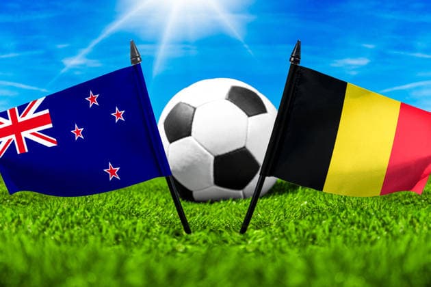May 22, 2026: PHOTO MONTAGE, 2026 FIFA World Cup, WM, Weltmeisterschaft, Fussball National flags of New Zealand and Belgium with a soccer ball on the field. Stock image for the group stage match on June 27 at the 2026 FIFA World Cup *** FOTOMONTAGE, Fußball-Weltmeisterschaft 2026: Nationalflaggen von Neuseeland und Belgien mit Fußball auf Rasen. Symbolbild zum WM-Gruppenspiel am 27 Juni bei der FIFA Fussball-Weltmeisterschaft 2026