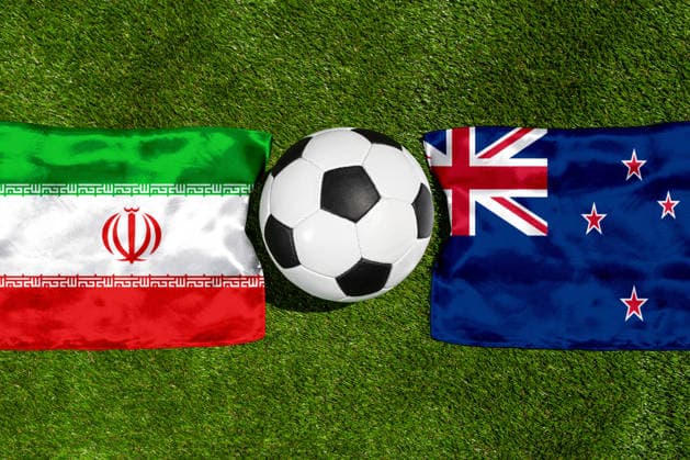 May 22, 2026: PHOTO MONTAGE, 2026 FIFA World Cup, WM, Weltmeisterschaft, Fussball National flags of Iran and New Zealand with a soccer ball on the grass. Illustrative image for the group stage match on June 16 at the 2026 FIFA World Cup *** FOTOMONTAGE, Fußball-Weltmeisterschaft 2026: Nationalflaggen von Iran und Neuseeland mit Fußball auf Rasen. Symbolbild zum WM-Gruppenspiel am 16 Juni bei der FIFA Fussball-Weltmeisterschaft 2026