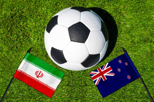 May 22, 2026: PHOTO MONTAGE, 2026 FIFA World Cup, WM, Weltmeisterschaft, Fussball National flags of Iran and New Zealand with a soccer ball on the grass. Illustrative image for the group stage match on June 16 at the 2026 FIFA World Cup *** FOTOMONTAGE, Fußball-Weltmeisterschaft 2026: Nationalflaggen von Iran und Neuseeland mit Fußball auf Rasen. Symbolbild zum WM-Gruppenspiel am 16 Juni bei der FIFA Fussball-Weltmeisterschaft 2026