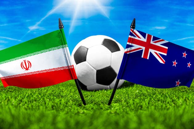 May 22, 2026: PHOTO MONTAGE, 2026 FIFA World Cup, WM, Weltmeisterschaft, Fussball National flags of Iran and New Zealand with a soccer ball on the grass. Illustrative image for the group stage match on June 16 at the 2026 FIFA World Cup *** FOTOMONTAGE, Fußball-Weltmeisterschaft 2026: Nationalflaggen von Iran und Neuseeland mit Fußball auf Rasen. Symbolbild zum WM-Gruppenspiel am 16 Juni bei der FIFA Fussball-Weltmeisterschaft 2026