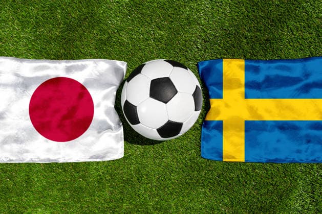 May 22, 2026: PHOTO MONTAGE, 2026 FIFA World Cup, WM, Weltmeisterschaft, Fussball National flags of Japan and Sweden with a soccer ball on the field. Illustrative image for the group stage match on June 26 at the 2026 FIFA World Cup *** FOTOMONTAGE, Fußball-Weltmeisterschaft 2026: Nationalflaggen von Japan und Schweden mit Fußball auf Rasen. Symbolbild zum WM-Gruppenspiel am 26 Juni bei der FIFA Fussball-Weltmeisterschaft 2026