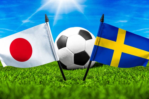 May 22, 2026: PHOTO MONTAGE, 2026 FIFA World Cup, WM, Weltmeisterschaft, Fussball National flags of Japan and Sweden with a soccer ball on the field. Illustrative image for the group stage match on June 26 at the 2026 FIFA World Cup *** FOTOMONTAGE, Fußball-Weltmeisterschaft 2026: Nationalflaggen von Japan und Schweden mit Fußball auf Rasen. Symbolbild zum WM-Gruppenspiel am 26 Juni bei der FIFA Fussball-Weltmeisterschaft 2026