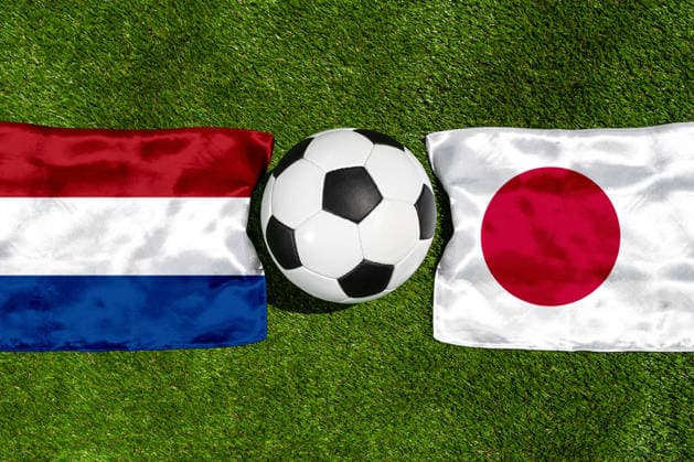 May 22, 2026: PHOTO MONTAGE, 2026 FIFA World Cup, WM, Weltmeisterschaft, Fussball National flags of the Netherlands and Japan with a soccer ball on the field. Illustrative image for the group stage match on June 14 at the 2026 FIFA World Cup *** FOTOMONTAGE, Fußball-Weltmeisterschaft 2026: Nationalflaggen von Niederlande und Japan mit Fußball auf Rasen. Symbolbild zum WM-Gruppenspiel am 14 Juni bei der FIFA Fussball-Weltmeisterschaft 2026