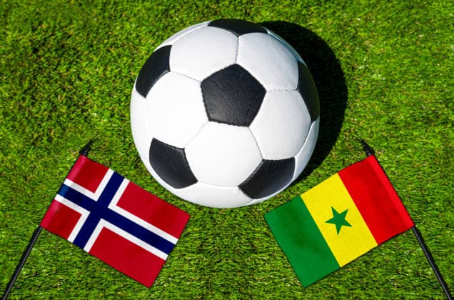 May 22, 2026: PHOTO MONTAGE, 2026 FIFA World Cup, WM, Weltmeisterschaft, Fussball National flags of Norway and Senegal with a soccer ball on the field. Stock image for the group stage match on June 23 at the 2026 FIFA World Cup *** FOTOMONTAGE, Fußball-Weltmeisterschaft 2026: Nationalflaggen von Norwegen und Senegal mit Fußball auf Rasen. Symbolbild zum WM-Gruppenspiel am 23 Juni bei der FIFA Fussball-Weltmeisterschaft 2026