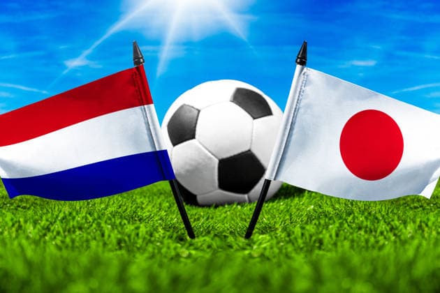 May 22, 2026: PHOTO MONTAGE, 2026 FIFA World Cup, WM, Weltmeisterschaft, Fussball National flags of the Netherlands and Japan with a soccer ball on the field. Illustrative image for the group stage match on June 14 at the 2026 FIFA World Cup *** FOTOMONTAGE, Fußball-Weltmeisterschaft 2026: Nationalflaggen von Niederlande und Japan mit Fußball auf Rasen. Symbolbild zum WM-Gruppenspiel am 14 Juni bei der FIFA Fussball-Weltmeisterschaft 2026