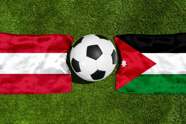 May 22, 2026: PHOTO MONTAGE, 2026 FIFA World Cup, WM, Weltmeisterschaft, Fussball National flags of Austria and Jordan with a soccer ball on the field. Illustrative image for the group stage match on June 17 at the 2026 FIFA World Cup *** FOTOMONTAGE, Fußball-Weltmeisterschaft 2026: Nationalflaggen von Österreich und Jordanien mit Fußball auf Rasen. Symbolbild zum WM-Gruppenspiel am 17 Juni bei der FIFA Fussball-Weltmeisterschaft 2026