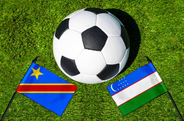 May 22, 2026: PHOTO MONTAGE, 2026 FIFA World Cup, WM, Weltmeisterschaft, Fussball National flags of Congo and Uzbekistan with a soccer ball on the field. Stock image for the group stage match on June 28 at the 2026 FIFA World Cup *** FOTOMONTAGE, Fußball-Weltmeisterschaft 2026: Nationalflaggen von Kongo und Usbekistan mit Fußball auf Rasen. Symbolbild zum WM-Gruppenspiel am 28 Juni bei der FIFA Fussball-Weltmeisterschaft 2026
