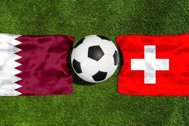 May 22, 2026: PHOTO MONTAGE, 2026 FIFA World Cup, WM, Weltmeisterschaft, Fussball National flags of Qatar and Switzerland with a soccer ball on the field. Stock image for the group stage match on June 13 at the 2026 FIFA World Cup *** FOTOMONTAGE, Fußball-Weltmeisterschaft 2026: Nationalflaggen von Katar und Schweiz mit Fußball auf Rasen. Symbolbild zum WM-Gruppenspiel am 13 Juni bei der FIFA Fussball-Weltmeisterschaft 2026