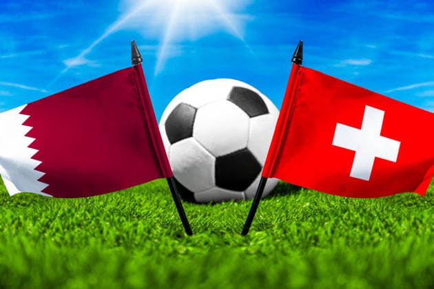 May 22, 2026: PHOTO MONTAGE, 2026 FIFA World Cup, WM, Weltmeisterschaft, Fussball National flags of Qatar and Switzerland with a soccer ball on the field. Stock image for the group stage match on June 13 at the 2026 FIFA World Cup *** FOTOMONTAGE, Fußball-Weltmeisterschaft 2026: Nationalflaggen von Katar und Schweiz mit Fußball auf Rasen. Symbolbild zum WM-Gruppenspiel am 13 Juni bei der FIFA Fussball-Weltmeisterschaft 2026