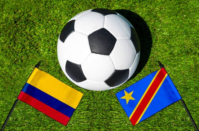 May 22, 2026: PHOTO MONTAGE, 2026 FIFA World Cup, WM, Weltmeisterschaft, Fussball National flags of Colombia and Congo with a soccer ball on the field. Stock image for the group stage match on June 24 at the 2026 FIFA World Cup *** FOTOMONTAGE, Fußball-Weltmeisterschaft 2026: Nationalflaggen von Kolumbien und Kongo mit Fußball auf Rasen. Symbolbild zum WM-Gruppenspiel am 24 Juni bei der FIFA Fussball-Weltmeisterschaft 2026