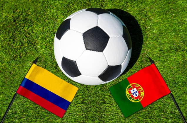 May 22, 2026: PHOTO MONTAGE, 2026 FIFA World Cup, WM, Weltmeisterschaft, Fussball National flags of Colombia and Portugal with a soccer ball on a field. Stock image for the group stage match on June 28 at the 2026 FIFA World Cup *** FOTOMONTAGE, Fußball-Weltmeisterschaft 2026: Nationalflaggen von Kolumbien und Portugal mit Fußball auf Rasen. Symbolbild zum WM-Gruppenspiel am 28 Juni bei der FIFA Fussball-Weltmeisterschaft 2026