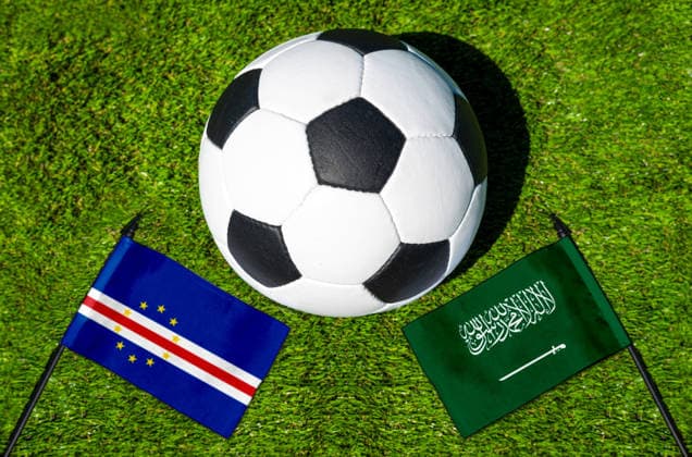 May 22, 2026: PHOTO MONTAGE, 2026 FIFA World Cup, WM, Weltmeisterschaft, Fussball National flags of Cape Verde and Saudi Arabia with a soccer ball on the field. Stock image for the group stage match on June 27 at the 2026 FIFA World Cup *** FOTOMONTAGE, Fußball-Weltmeisterschaft 2026: Nationalflaggen von Kap Verde und Saudi-Arabien mit Fußball auf Rasen. Symbolbild zum WM-Gruppenspiel am 27 Juni bei der FIFA Fussball-Weltmeisterschaft 2026