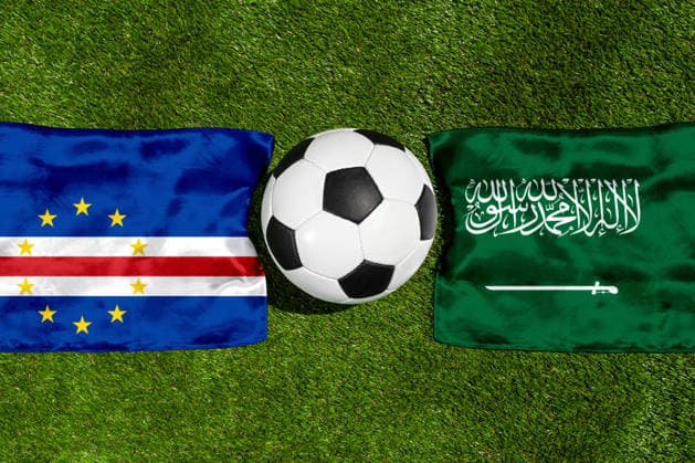 May 22, 2026: PHOTO MONTAGE, 2026 FIFA World Cup, WM, Weltmeisterschaft, Fussball National flags of Cape Verde and Saudi Arabia with a soccer ball on the field. Stock image for the group stage match on June 27 at the 2026 FIFA World Cup *** FOTOMONTAGE, Fußball-Weltmeisterschaft 2026: Nationalflaggen von Kap Verde und Saudi-Arabien mit Fußball auf Rasen. Symbolbild zum WM-Gruppenspiel am 27 Juni bei der FIFA Fussball-Weltmeisterschaft 2026
